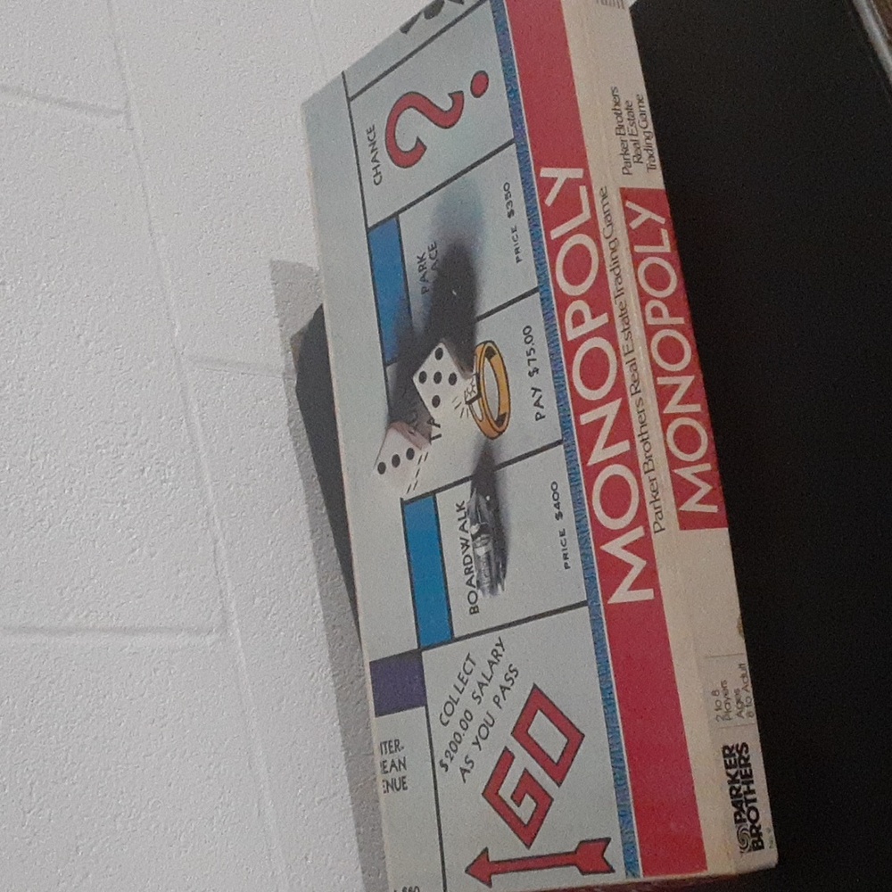 1974 Monopoly game. Partially sealed. Overall good condition